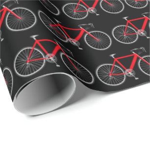 Regalo bicicleta roja sobre papel de envoltura negro