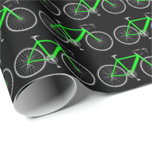 Regalo bicicleta verde sobre papel de envoltura negro