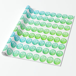 Regalo Bolas azules verdes sobre papel de envolver blanco