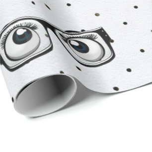Regalo Bolas de ojos y lentes sobre papel envuelto con pu