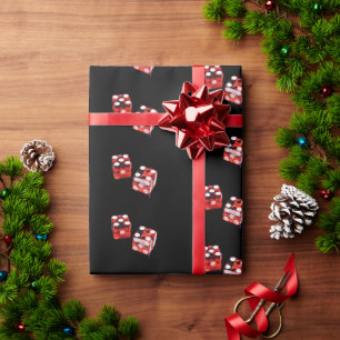Regalo Dice rojo y blanco sobre papel de envolver negro