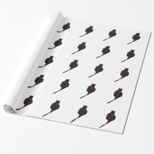 Regalo Gato negro en el papel de embalaje blanco