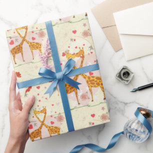 Regalo jirafas en papel envuelto de amor