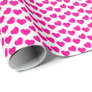 Regalo Modelo rosado del corazón en el papel de embalaje