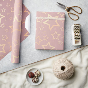Regalo papel de envoltura rosa de estrellas doradas
