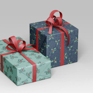 Regalo Papel navideño con copos de nieve y acebo