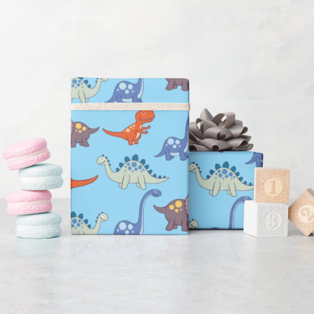 Regalo Roca de dinosaurios sobre papel de envolvimiento a (Baby Shower)