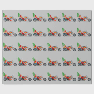 Regalo Santa en un papel de embalaje de la motocicleta