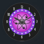 Reloj Atomic Symbol on a Pink background<br><div class="desc">Science themed image. A circular shaped image with the symbol of the atom inside. A pink background contrasts with the black symbol. A purple border with white stars circles around the illustration. A funky image for geeks and science buffs.</div>