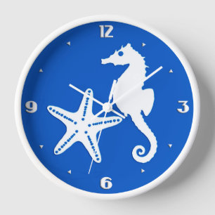 Reloj Caballo de mar y pez estrella - blanco sobre azul 