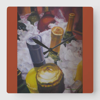 Reloj con botellas de vino en un cubo