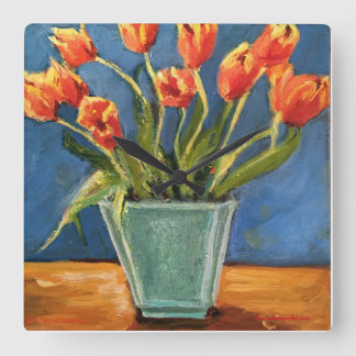 Reloj con los tulipanes anaranjados rojos