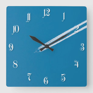 Reloj Cuadrado Avión volador sobre un fondo azul del cielo