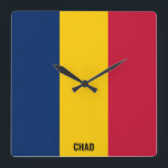 Reloj Cuadrado Bandera de Chad deslumbrando patriótico<br><div class="desc">Bandera de Chad deslumbrando el reloj de pared de la Plaza Patriótica con los colores y los elementos de la bandera nacional de Chad cubriendo la parte delantera del reloj. Los colores de la bandera nacional se complementan con el texto "Chad" en la parte inferior. El texto es totalmente personalizable...</div>