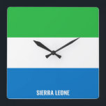 Reloj Cuadrado Bandera de Sierra Leona deslumbrando al patriótico<br><div class="desc">Bandera de Sierra Leona Deslumbrando el reloj del muro de la Plaza Patriótica con los colores y los elementos de la bandera nacional de Sierra Leona cubriendo la parte delantera del reloj. Los colores de la bandera nacional se complementan con el texto "Sierra Leona" en la parte inferior. El texto...</div>