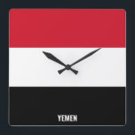 Reloj Cuadrado Bandera yemení deslumbrante patriótico<br><div class="desc">Bandera de Yemen Deslumbrando el reloj de pared Patriótico de la Plaza en los colores y los elementos de la bandera nacional de Yemen cubriendo la parte delantera del reloj. Los colores de la bandera nacional se complementan con el texto "Yemen" en la parte inferior. El texto es totalmente personalizable...</div>