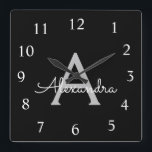 Reloj Cuadrado Black Silver Modern Script Girly Monograma Nombre<br><div class="desc">Reloj de nombres de monograma de escritura plateado y negro. Esto hace que el dulce perfecto cumpleaños 16,  boda,  ducha de novia,  aniversario,  ducha de bebé o fiesta de soltera sea regalo para alguien que ama el lujo glam y los estilos de moda.</div>