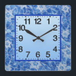 Reloj Cuadrado Estrellas de David Stainde Glass<br><div class="desc">Reloj acrílico de 10.75" x 10.75" con una imagen de las Estrellas de David en un diseño de vidrio de color azul sobre azul. Cara de reloj fácil de leer en azul nivelado con borde azul real. Vea toda la colección Hanukkah Clock en la categoría HOME de la sección HOLIDAYS....</div>