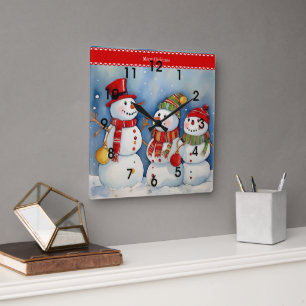 Reloj Cuadrado Feliz Navidad, tres muñecos de nieve coloridos,