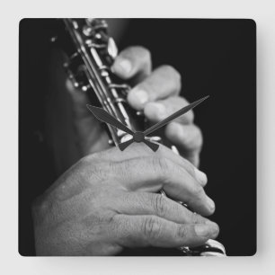 Reloj Cuadrado Flute being played in black and white by gypsy