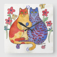 Gatos que llevan a cabo arte popular de las manos
