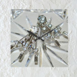 Reloj Cuadrado Glam Vintage Art Deco Diamantes de imitación acríl<br><div class="desc">La imagen fotográfica de aretes diamante de imitación de arte vintage deco añade el retro glam a este elegante y glamoroso reloj de pared acrílico. La joyería de arte se basa en un fondo de cristal cortado. El conjunto es un gris plateado que parece brillar con toques de azul pálido...</div>