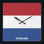 Reloj Cuadrado Patriótico de Bandera Nacional de los Países Bajos<br><div class="desc">Bandera Nacional de los Países Bajos reloj de pared de la Plaza Patriótica con la bandera del país en los colores nacionales impresos a lo largo de las 24 horas. El nombre del país está sutilmente integrado en el diseño de la parte inferior. El texto es totalmente personalizable usando la...</div>