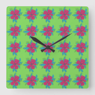 Reloj Cuadrado Patrón de flores coloridas sobre fondo verde