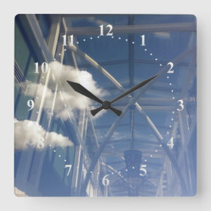 Reloj Cuadrado reflections in window