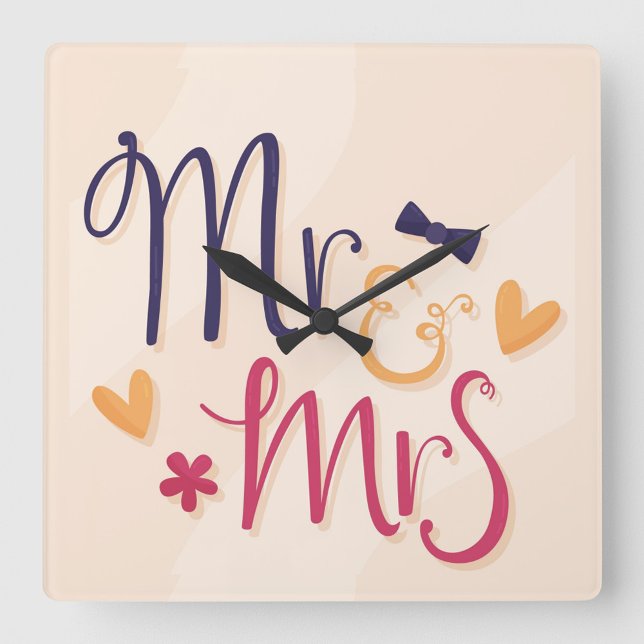 Reloj Cuadrado Sr. y Sra. Acrylic Wall Clock (Square wall clock with the words "Mr. & Mrs" in a playful, cartoonish font.)