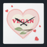 Reloj Cuadrado Vegan<br><div class="desc">Reloj de pared vegano con corazones rosados.</div>