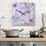 Reloj Cuadrado Vintage blue purple floral watercolor romantic<br><div class="desc">Bold, white easy-to-read numerals, along with white, purple, and blue watercolor flowers, overlay white script on a gorgeous, soft periwinkle purple blue, gold veined background. Enliven up your favorite room with this chic, stunning, stylish wall clock. Your choice of a round or square clock face. Makes a wonderful, elegant statement...</div>