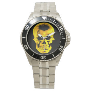 Reloj de cráneo dorado