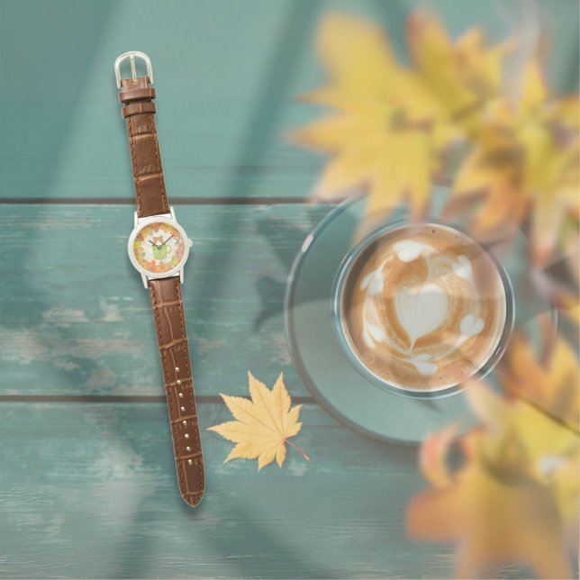 Reloj de gatos de caída (A Fall Break Cat Watch is on the table outside. )