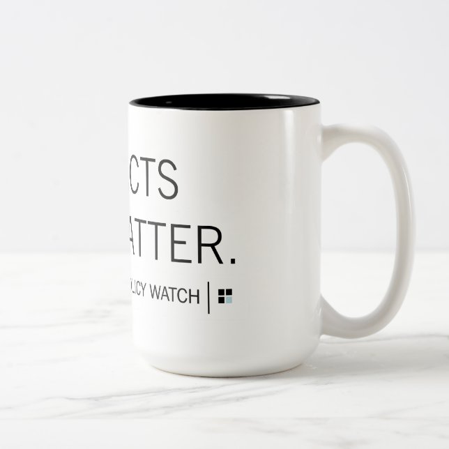 Reloj de la política del NC: Taza de la materia el (Derecha)