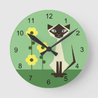 Reloj de la ronda verde del gato y la flor