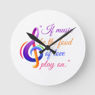 Reloj de notas musicales con cita musical.