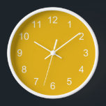 Reloj de pared amarillo mostaza<br><div class="desc">Reloj de pared amarillo mostaza. Sencillo diseño minimalista de color mostaza con horas blancas.</div>