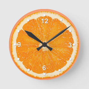 Reloj de pared anaranjado jugoso de la cocina