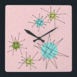 Reloj de pared atómico icónico rosado de<br><div class="desc">Este modelo de acrílico cuadrado atómico icónico rosado del reloj de pared de Starbursts ofrece starbursts atómicos icónicos. ¡Eso correcto! La escuela vieja, primera señora Pink coloreó el fondo con los puntos del oro es el contexto perfecto para la turquesa vibrante, el apio calmante, y los círculos coloreados del verde...</div>