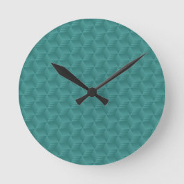 Reloj de pared azul verdoso con un patrón geométri