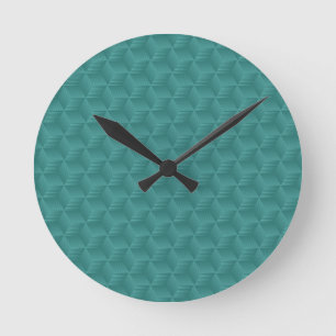 Reloj de pared azul verdoso con un patrón geométri