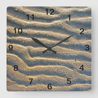 Reloj de pared beige de playa de arena