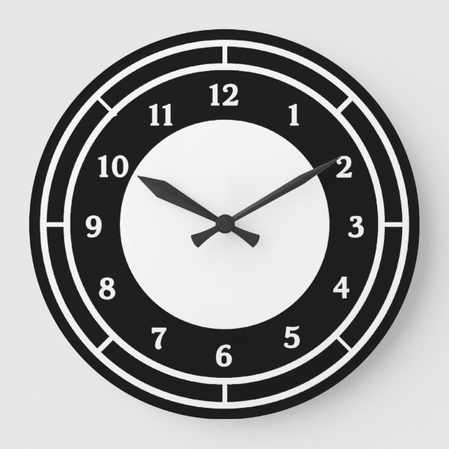 Reloj de pared blanco y negro