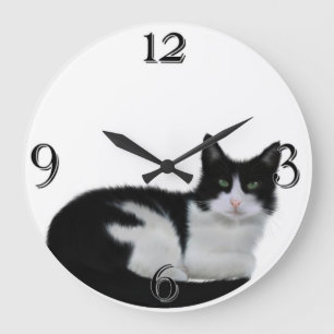 Reloj de pared blanco y negro lindo del gato