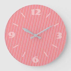 Reloj de pared bonito en rosa polvoriento