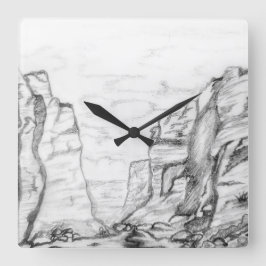 Reloj de pared con cañón dibujado en blanco y negr