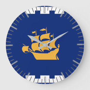 Reloj de pared con la bandera de la ciudad de Queb