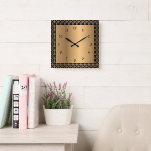 Reloj de pared cuadrado elegante negro y dorado