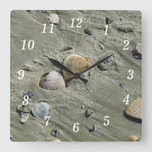 Reloj de pared de conchas y arena